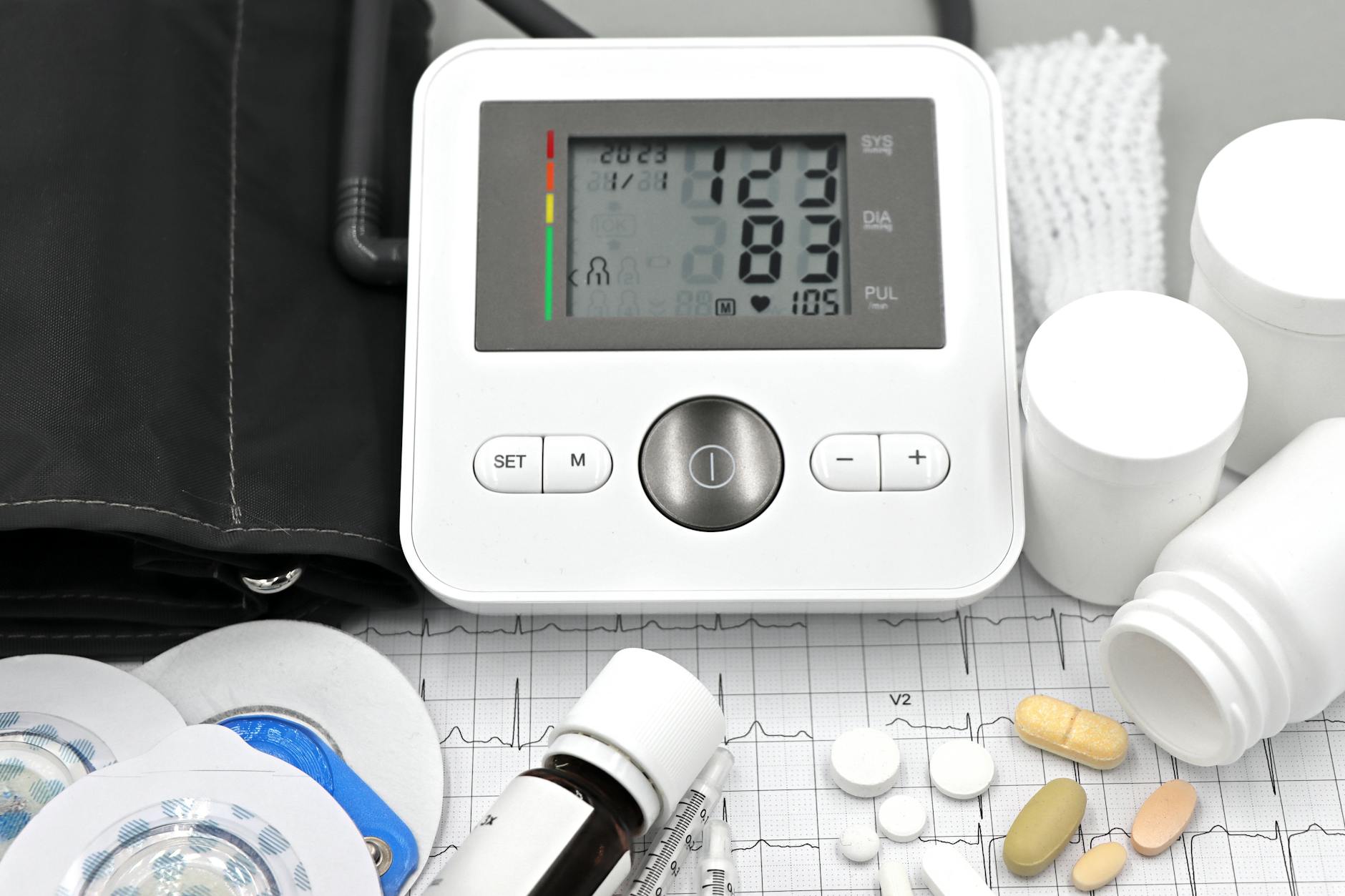 medical equipment with pills and ecg printout